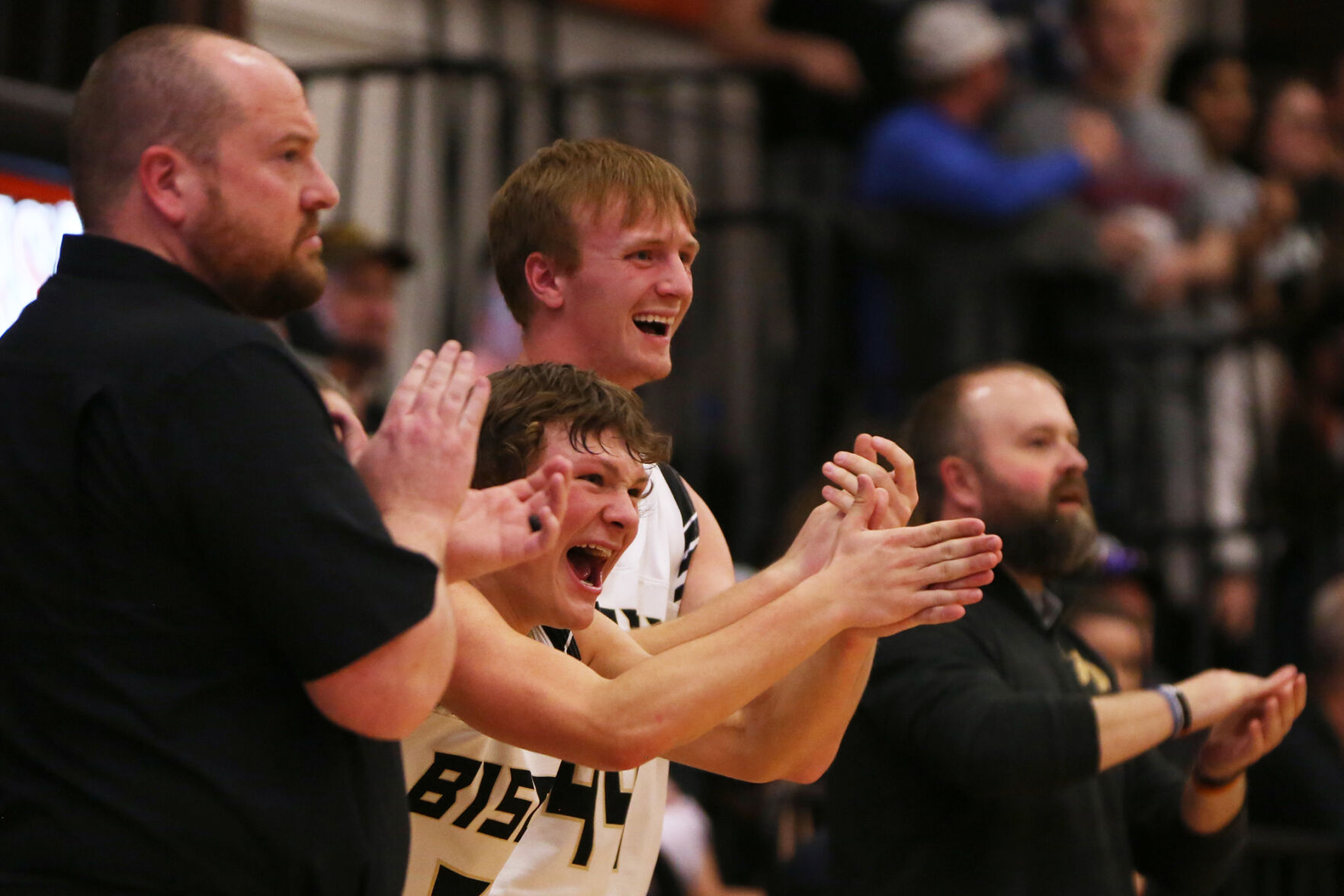 Buffalo High School’s bench screams in celebration of a foul